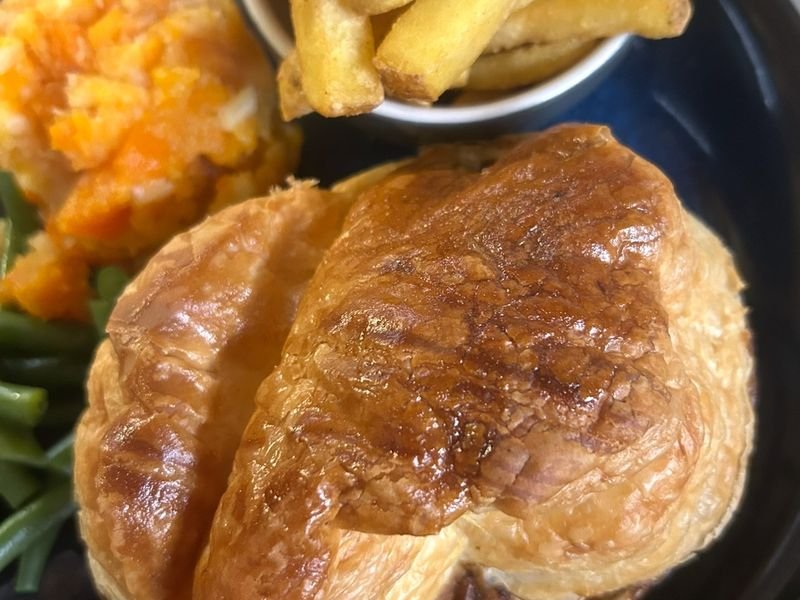One of our signature pies, with chips and vegetables