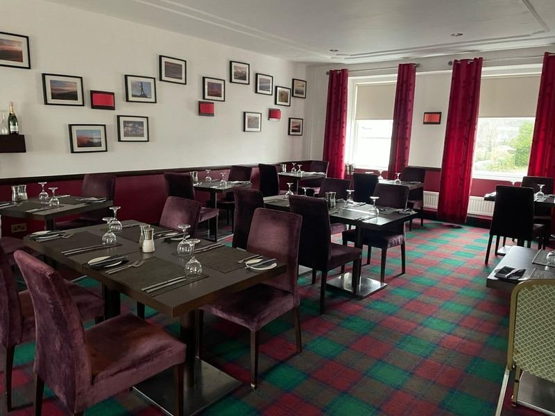 The old dining room, with tartan carpet and red curtains