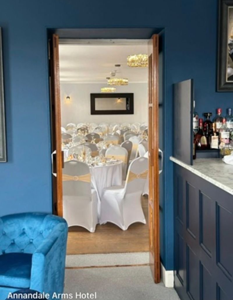 Through the double doors from the bar into the function room, laid for a wedding