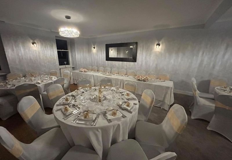 The function room set with round tables and a top table